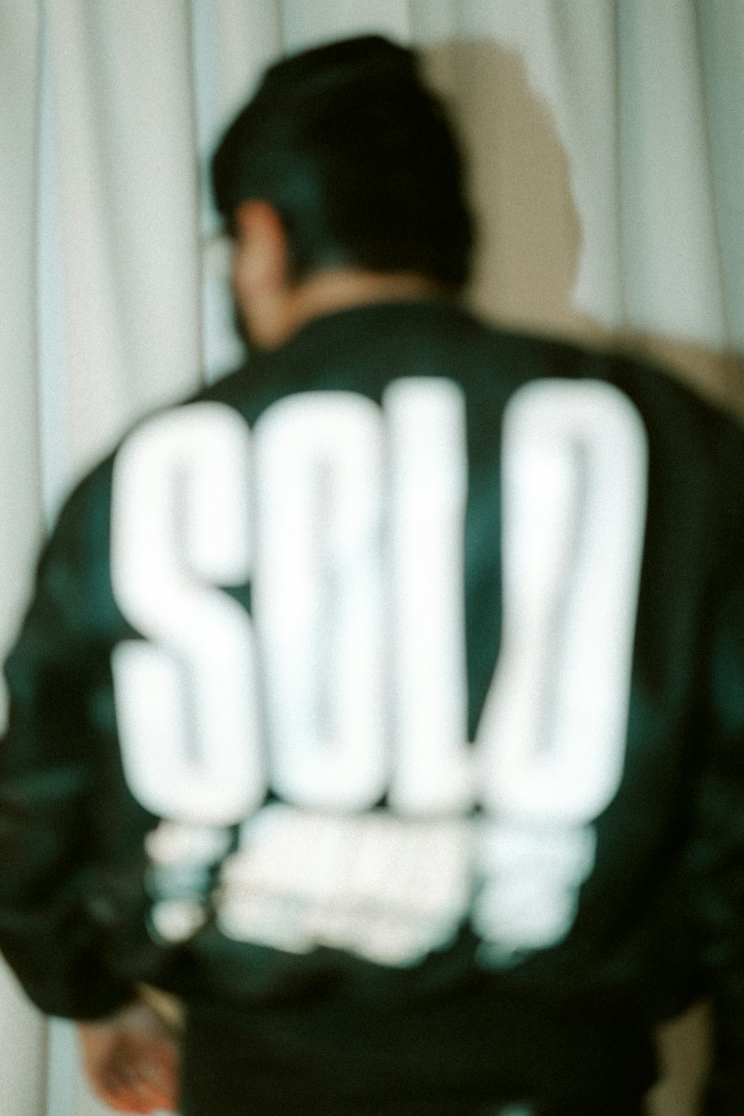 a-persons-jacket-has-sold-written-on-it-u1e4v-atmug